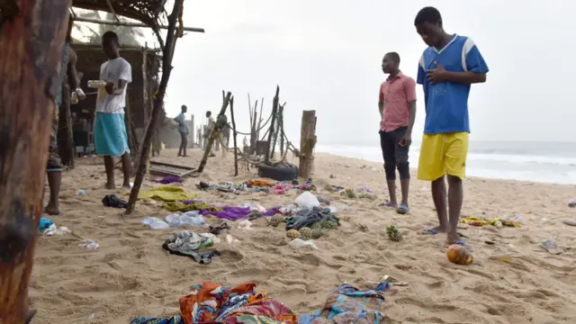 People on Grand Bassam beach after gunmen attacked