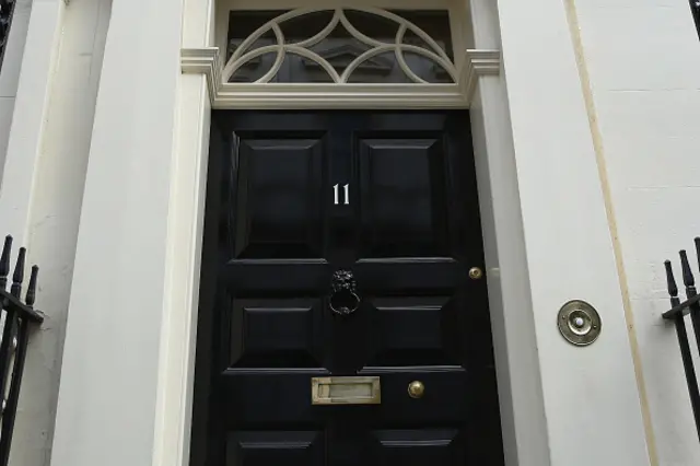 Number 11 is displayed on the door of the official residence of Britain's Second Lord of the Treasury