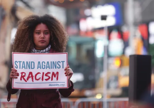 Members of MoveOn.org Political Action stand outside the studios of "Good Morning America"