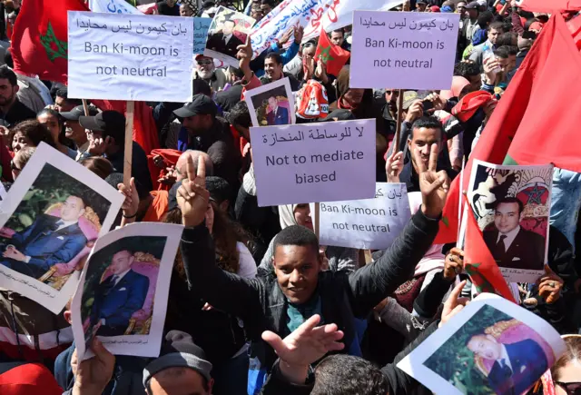 Moroccan protesters hold placards and shout slogans in the capital Rabat, on March 13, 2016