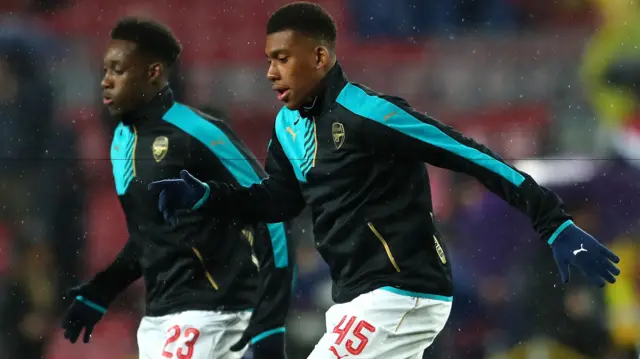 Danny Welbeck and Alex Iwobi warm up