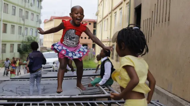 Children jump on a trampoline at the Alexandra Trampoline Club in the township of Alexandra in Johannesburg, South Africa