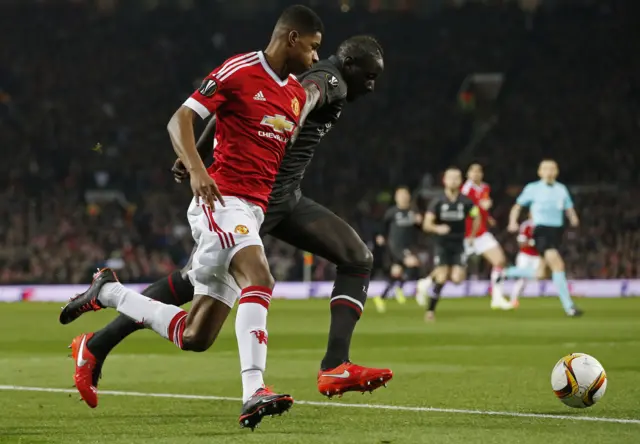 Marcus Rashford battles for the ball