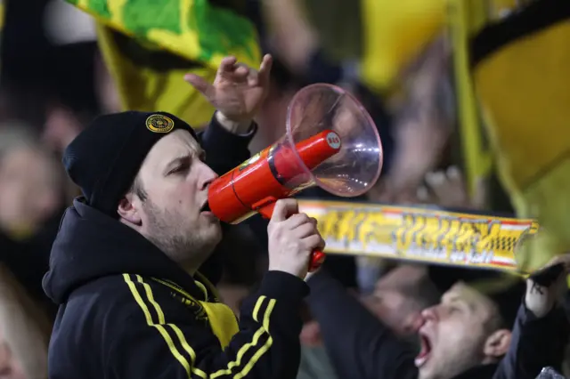 A Dortmund fan with a megaphone