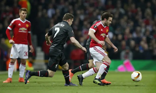 Juan Mata battles for the ball