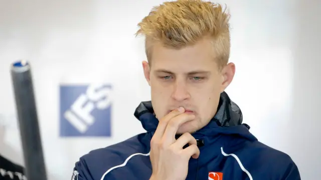 Marcus Ericsson of Sauber waits inside the team garage for second practice to start