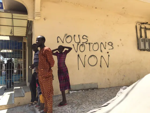 The graffiti reads: "We vote no"