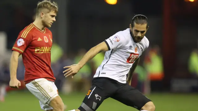 Jamie Ward (left) in action for Forest against former side Derby County