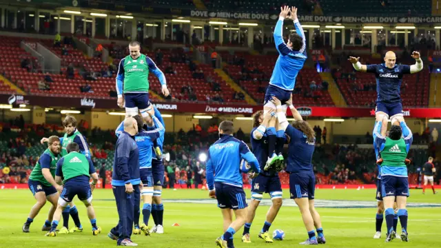 Italy's players warm-up