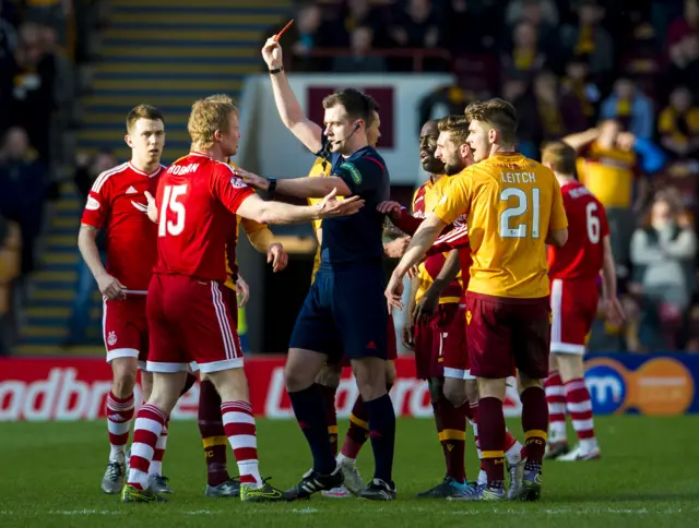 Referee Don Robertson sends off Aberdeen midfielder Barry Robson