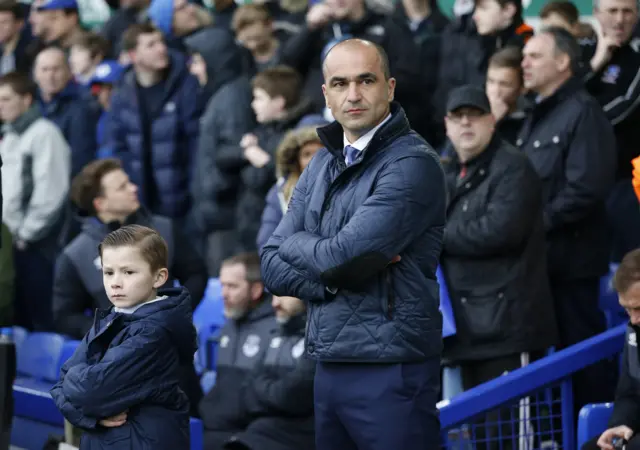 Everton manager Roberto Martinez watches on