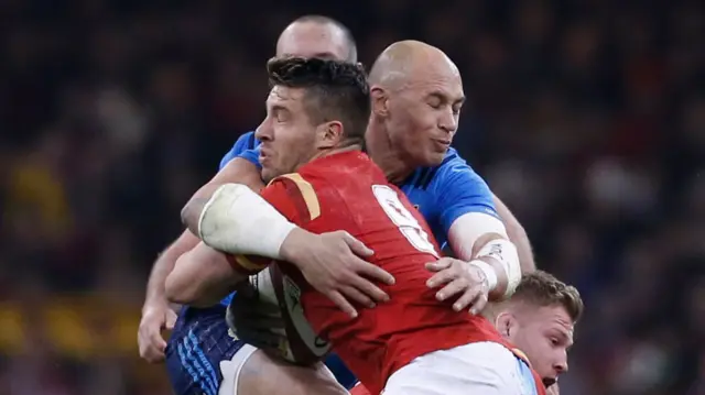 Rhys Webb is tackled by Sergio Parisse