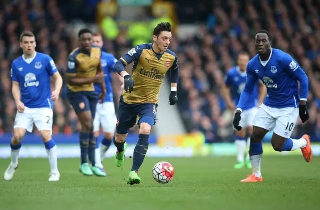 Mesut Ozil attacks for Arsenal