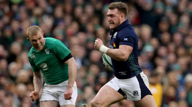 Stuart Hogg runs through to score a try for Scotland