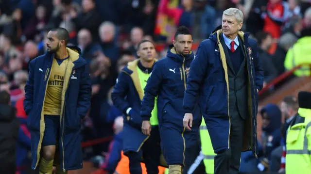 Arsene Wenger (right) at Old Trafford