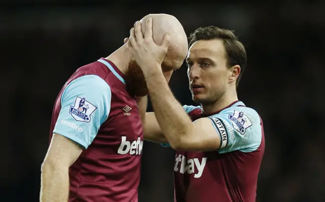 James Collins is consoled by Mark Noble