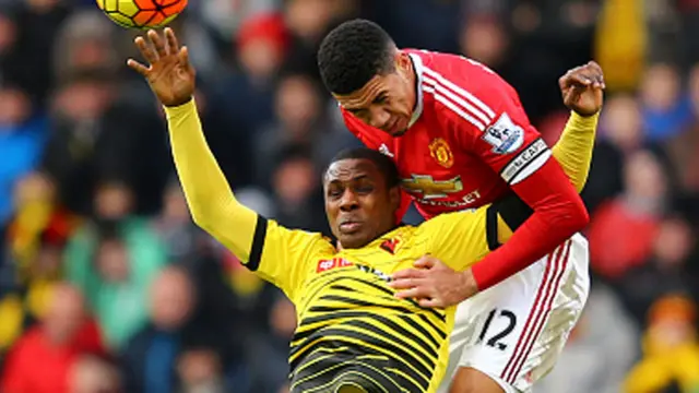 Odion Ighalo of Watford battles with Chris Smalling of Manchester United