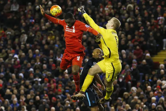 Joe Hart in action with Liverpool's Christian Benteke