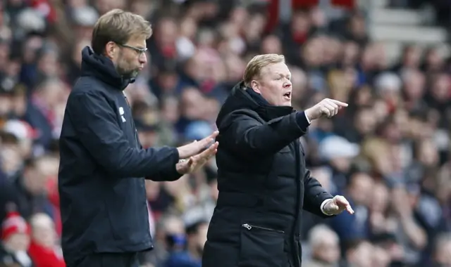 Ronald Koeman and Jurgen Klopp give instructions to their players