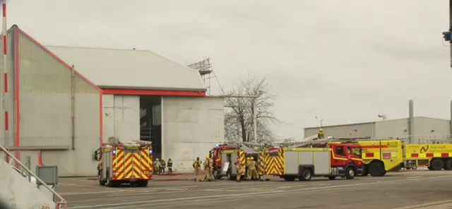 Fire crews outside the hangar at Norwich Airport