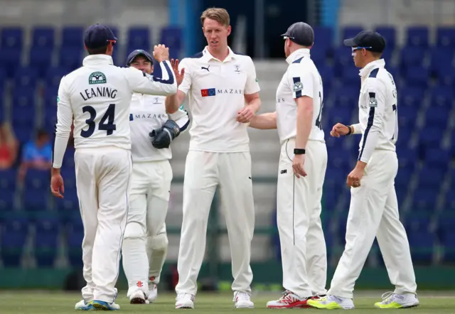 Steve Patterson celebrates taking a wicket for Yorkshire on day two of the County Champion match