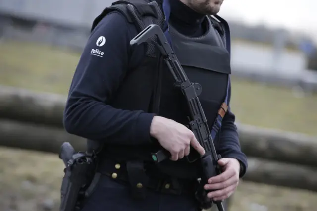 A Belgian police officer stands guard at the French-Belgian border, northern France, on March 22, 2016