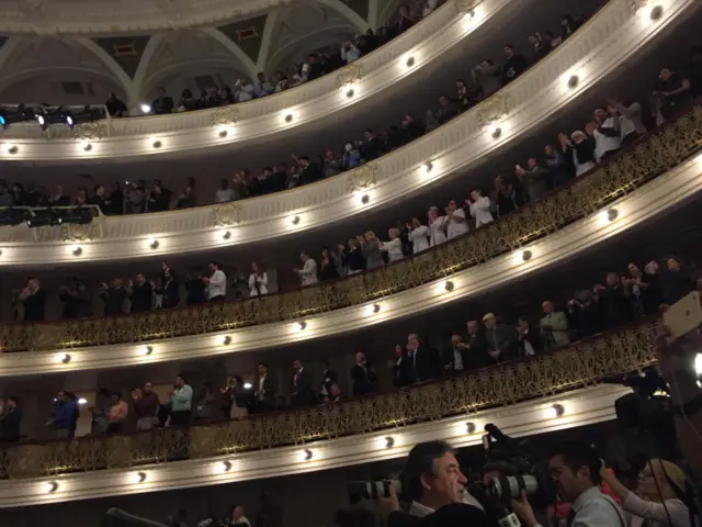 Standing ovation as President Obama strides onto the stage