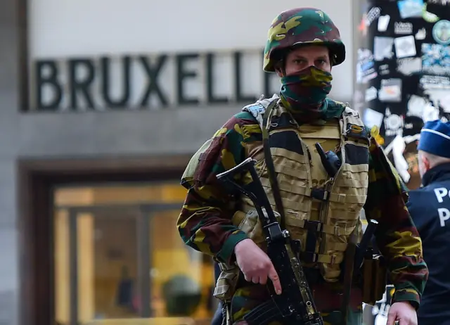 A Belgian soldier patrols outside Brussels