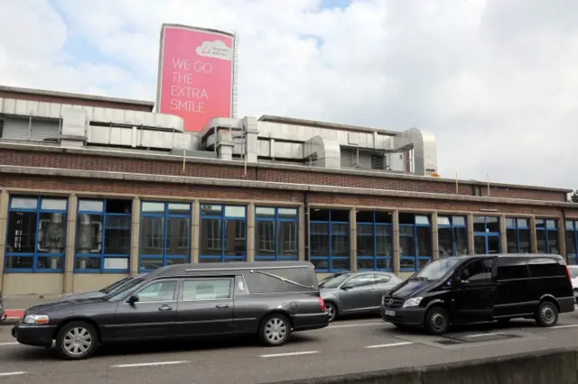 Hearses wait at Zaventem International Airport after a terrorist attack on 22 March 2016