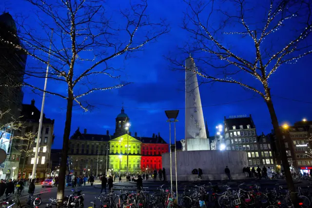 The Royal Palace at Dam Square in Amsterdam, is seen with the black, yellow and red colours of the Belgian flag in tribute to the victims of the Brussels terror attacks