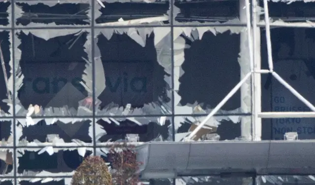 The blown out facade of the terminal is seen at Zaventem airport, one of the two sites attacked in Brussels, Belgium, Tuesday, March 22, 2016