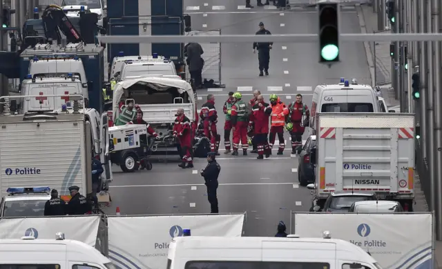 Police and rescue teams are pictured outside the metro station Maelbeek in Brussels, Tuesday, March 22, 2016.