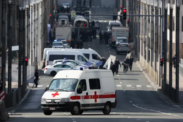 Soldiers, police officers and medical personnel attend the scene at the Maelbeek metro station following todays attack on March 22, 2016