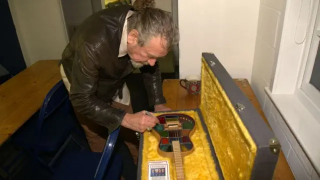 Robert Plant signs mandolin