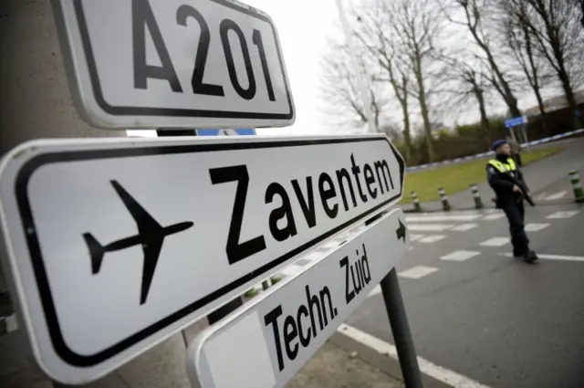 A Belgian soldier controls an access point to Brussels airport in Zaventem