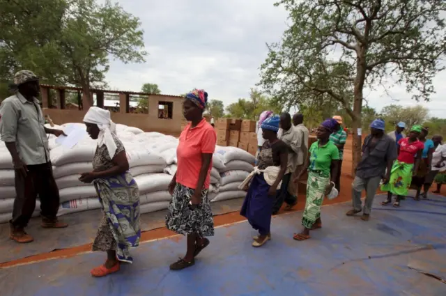 Villagers collect their monthly food ration provided by the UN WFP in Masvingo, Zimbabwe - January 2016