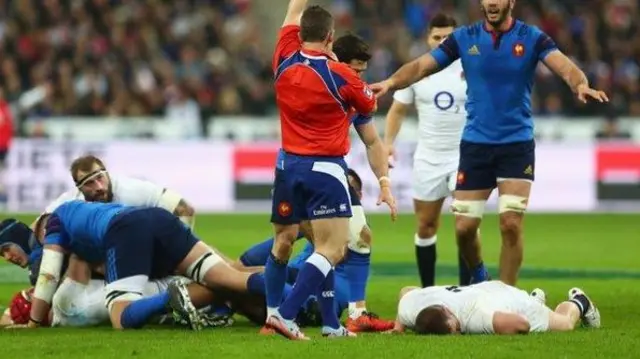 Dylan Hartley lies on the floor after the clash with Atonio