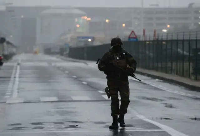 A Belgian soldier patrols near Brussels airport in Zaventem on Wednesday