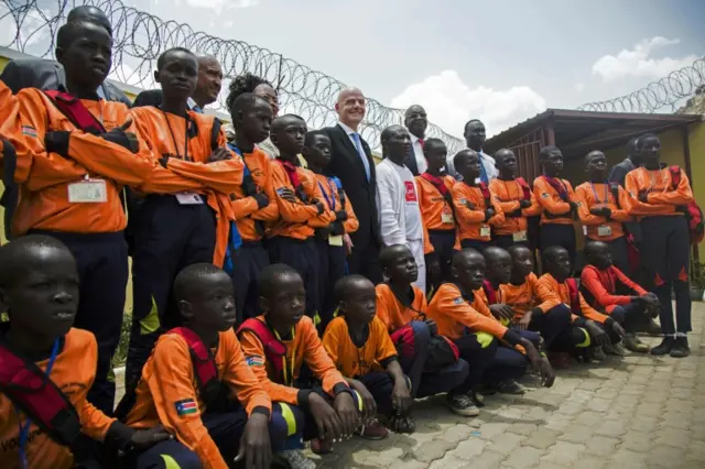 New Fifa chief Gianni Infantino (C) poses for a picture with young South Sudanese football players