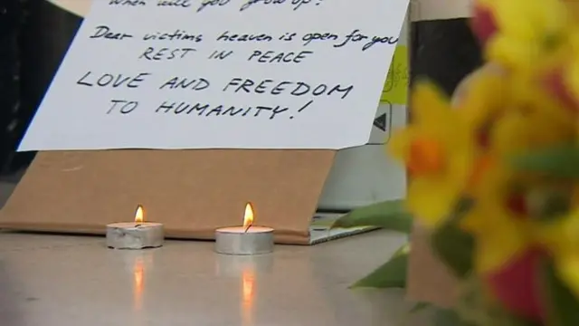 Tributes have been left outside the Belgian Embassy in London