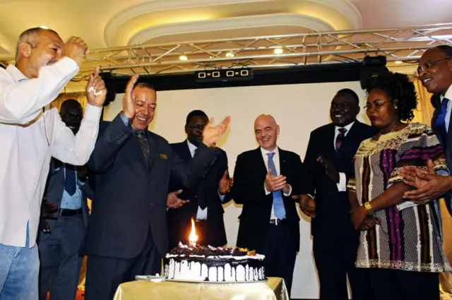 Gianni Infantino receives a birthday cake in Juba from football administrators