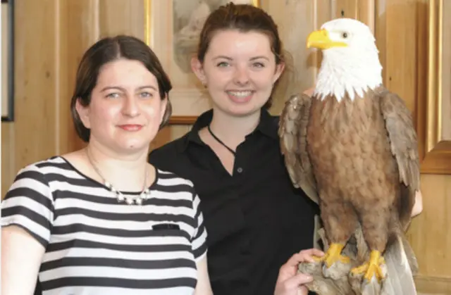 Joseane Silva, assistant manager and Abby Weaver with the eagle