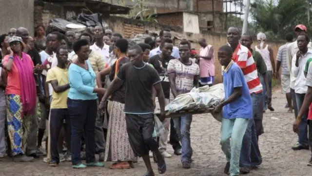 Burundians carry the body of someone killed in unrest in Bujumbura