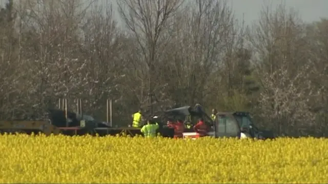 Emergency workers removing aircraft wreckage