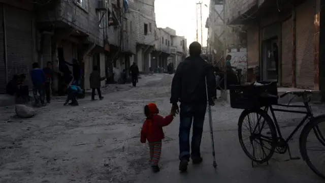 Man and child in Syria