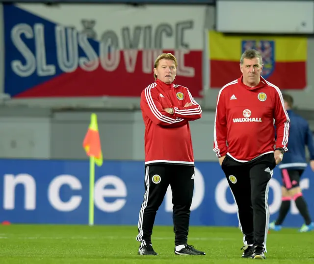 Scotland coaches Stuart McCall and Mark McGhee take in the pre-match atmosphere in Prague.