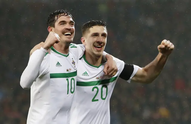 Craig Cathcart celebrates scoring the first goal for Northern Ireland with Kyle Lafferty