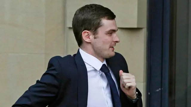 Adam Johnson running into court