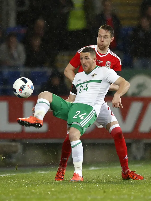 Northern Ireland's Conor Washington and Wales' Chris Gunter