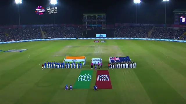 The teams stand for the national anthems